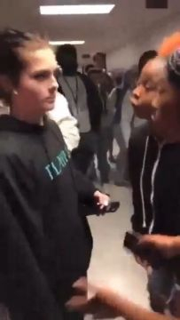 A Fight Between Two Girls In A School Hallway