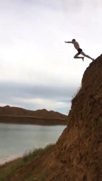Dude Jumped Off A Cliff Into The Water, And Landed On The Shore