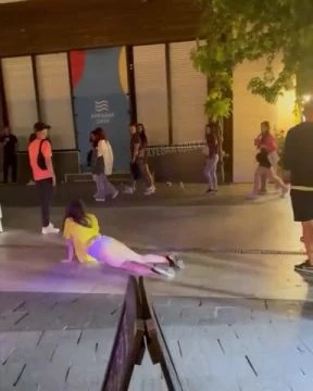 A Drunk Whore Performs On The Street. Ukraine