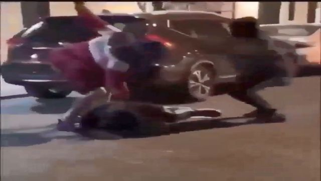 Two Men Brutally Beat A Poor Man Lying On The Ground