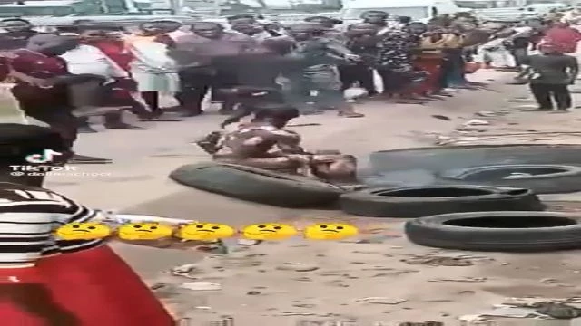 Man Trying To Defense Himself While Punished By Mob