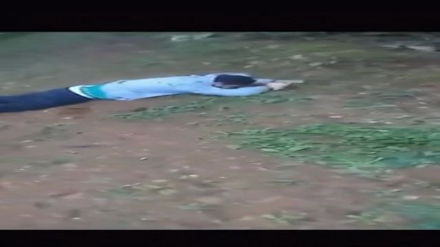 Guy Face Down In The Dirt Shot Multiple Times