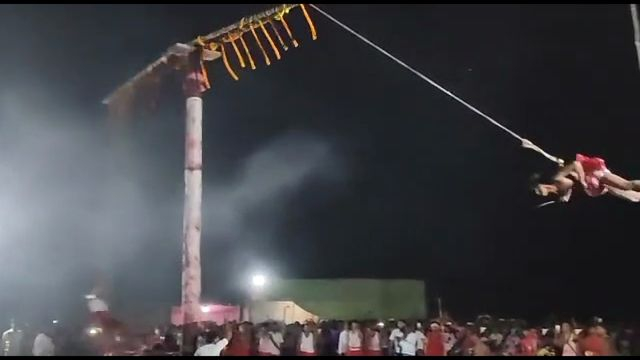 Man Swinging With A Rope Thrown To The Spectators