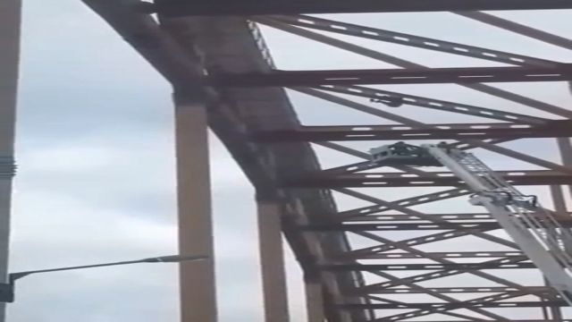 Man Falls While Swinging On The Top Of Bridge
