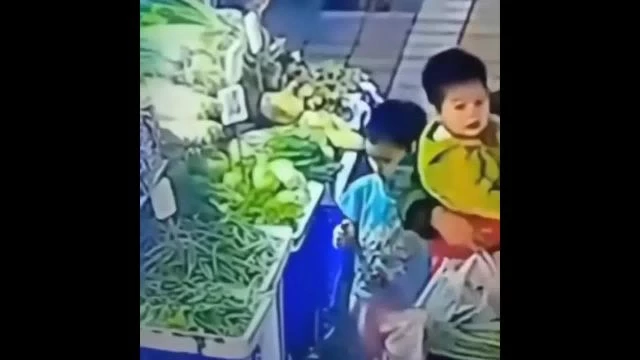 A Boy Playing With A Lighter Set Fire To A Street Vendor's Stall