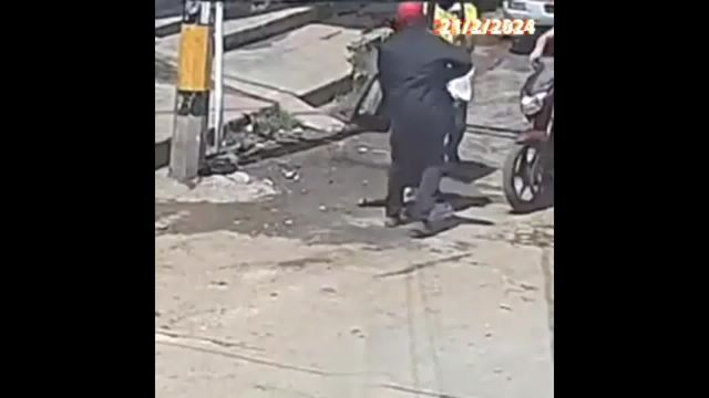 A Couple Of Criminals Robbed A Woman And Shot A Man On The Street In The Middle Of The Day
