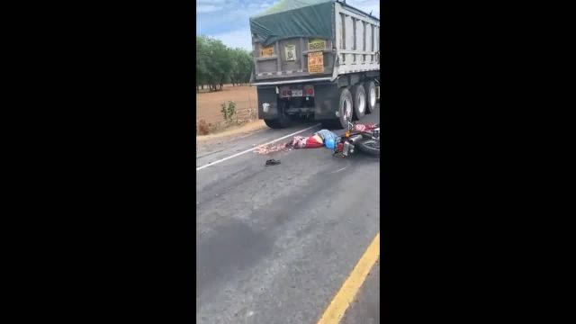 Again A Motorcycle, The Crushed Head Of A Motorcyclist And Truck