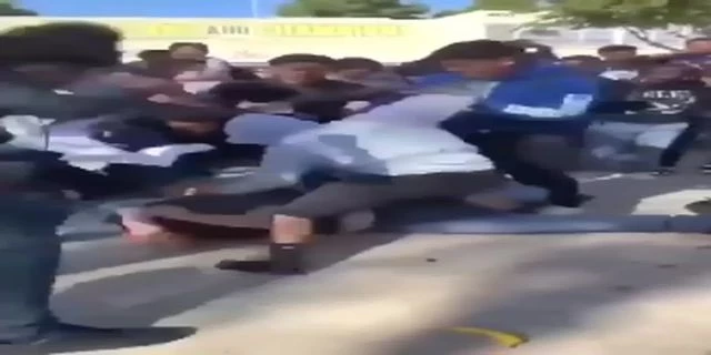 Teens Kick A Lying Dude