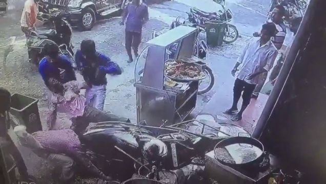A Guy On A Motorcycle Crashes Into A Street Vendor's Shop