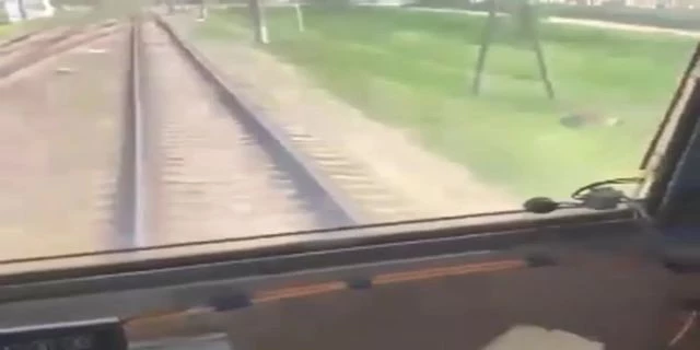 The Girl In The Headphones Did Not Hear The Rushing Train..