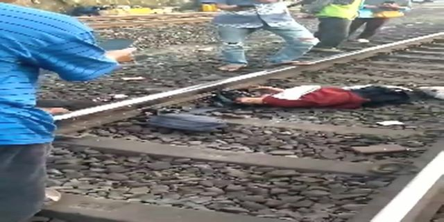 The Body Of A Woman Without A Face On The Railway Tracks