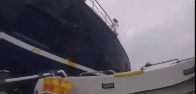 A Trawler Has Blown A Fishing Boat Out Of Its Way Off The Coast Of Britain
