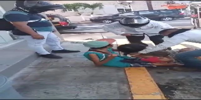 A Couple Of Gangsters Beat Up A Man On The Street In Front Of His Woman. Mexico