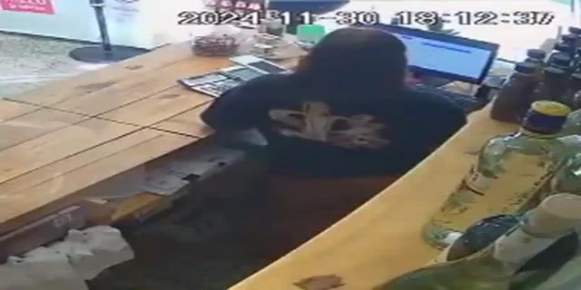 A Thief Walked Into A Store, Pulled Out A Hidden Rock, And Angrily Threw It At The Cashier